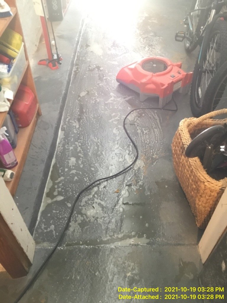 Fixing the water damage on the floor with a water restoration equipment