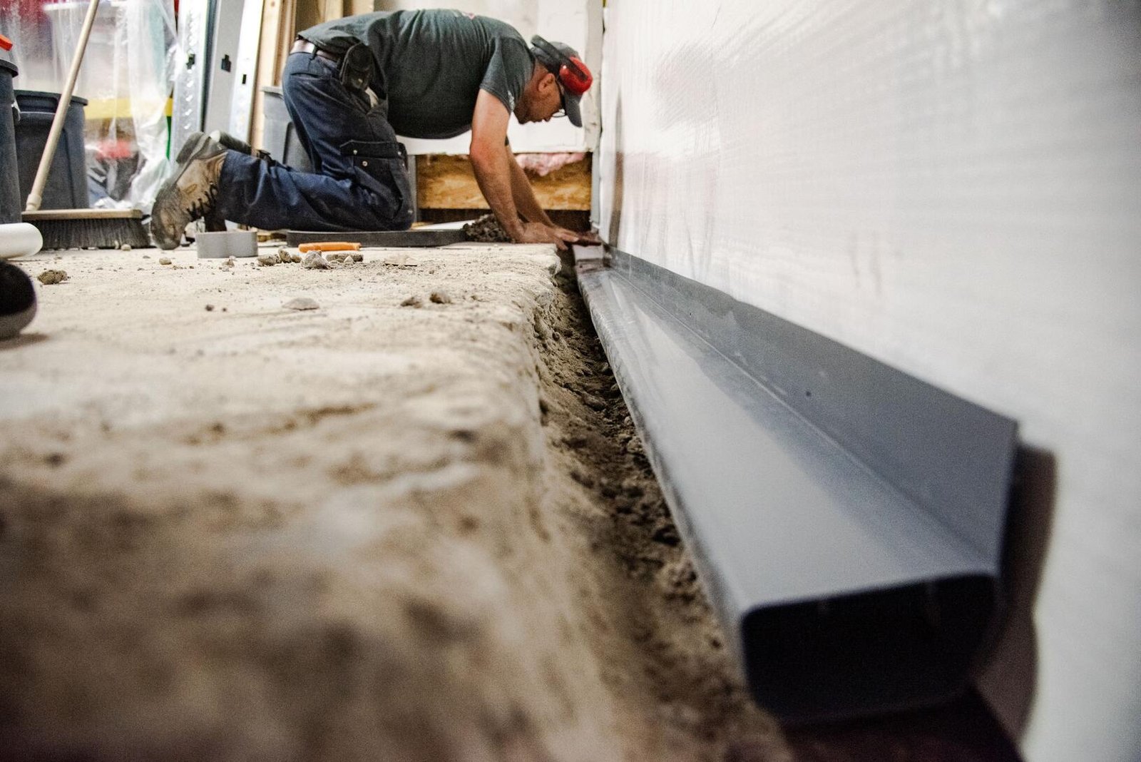 Basement waterproofing and drainage repair for water intrusion prevention